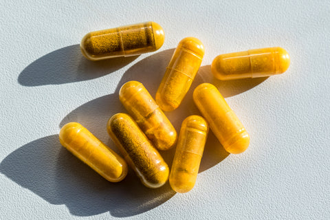 Close-up of turmeric capsules on table